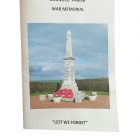 A booklet titled "Dornock Parish War Memorial" with a colour photograph of the war memorial and the words "Lest we forget" underneath.