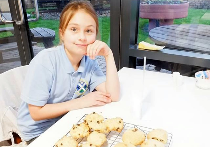 A happy child at The Devil's Porridge Museum's Let’s Bake Club.