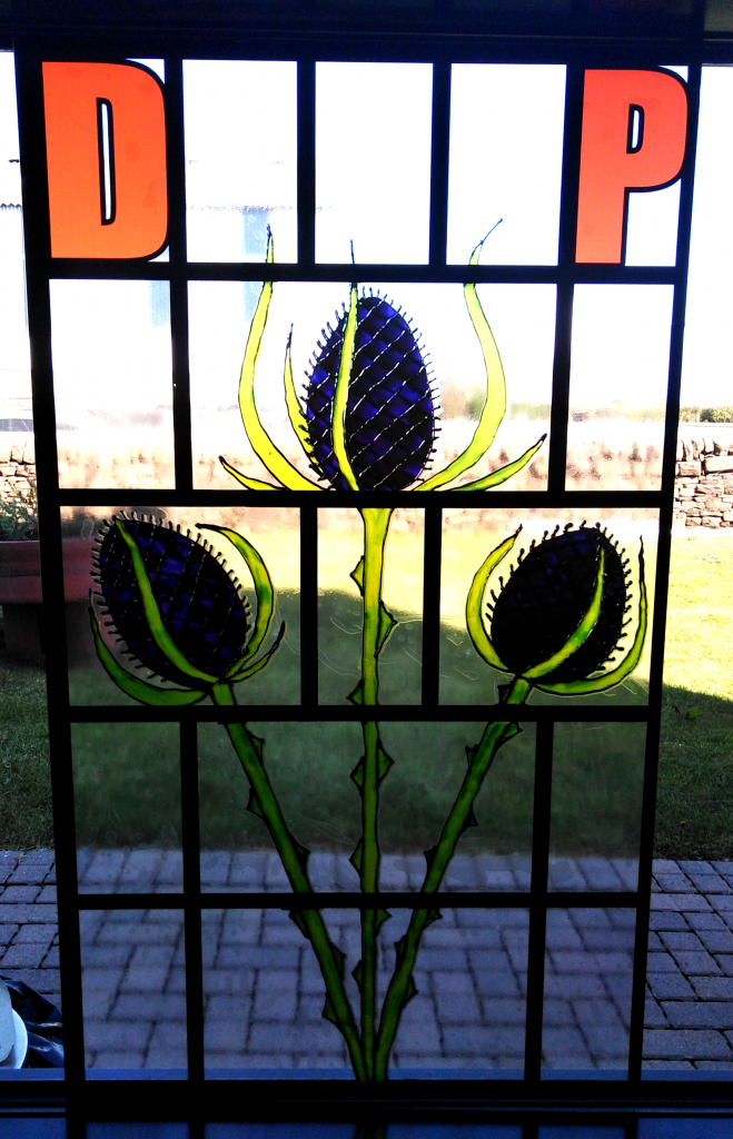 Some Rennie Mackintosh style window art.