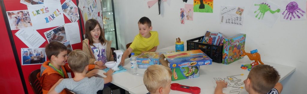 young people playing board games in The Devil's Porridge Museum at Games Club.