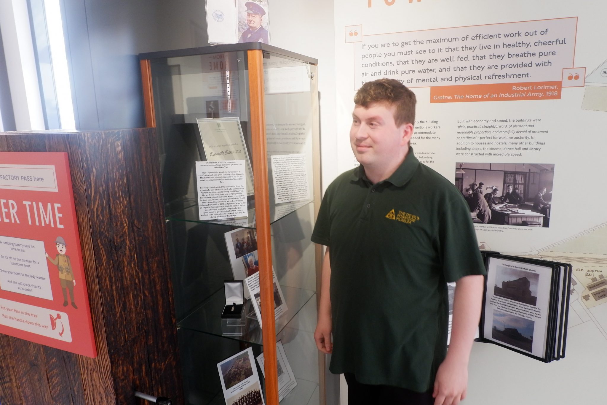 A volunteer stood next to the museum's object of the month display.
