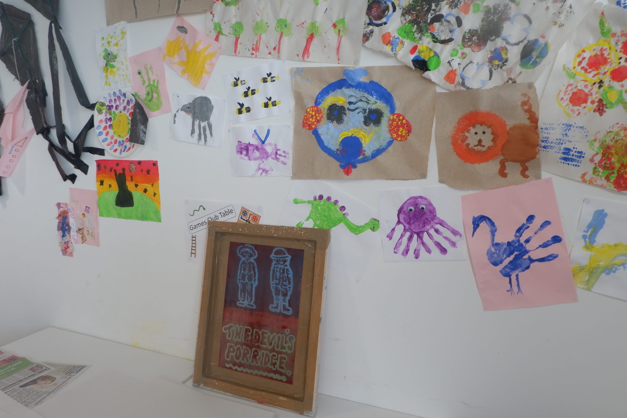 Some children's artwork on a wall in The Devil's Porridge Museum.