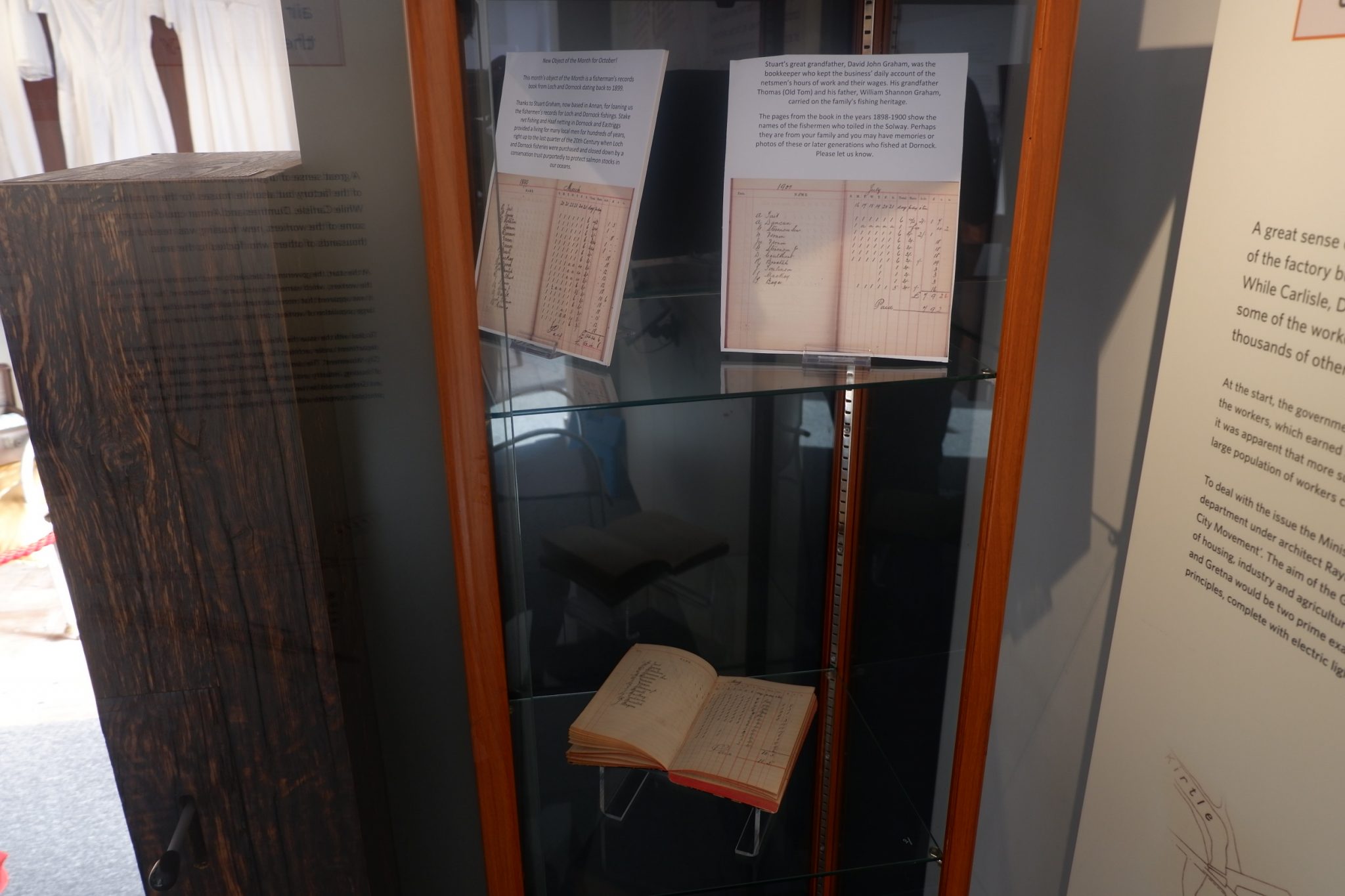 A book and some information panels featuring it's pages on display in The Devil's Porridge Museum.