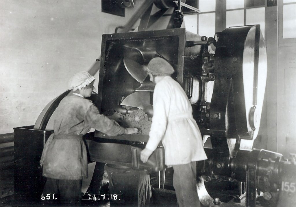 Two munition workers unloading the Incorporator.