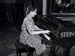 Ivy Herbert taking part in a CEMA organised concert in 1942