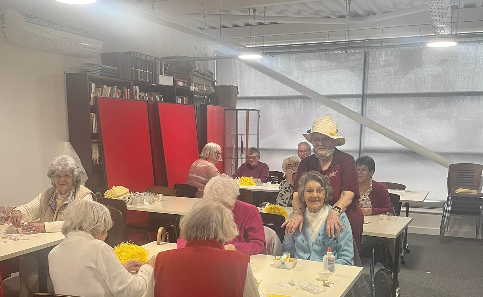 Some of the Devil's Porridge Museum's Cordite Club sat at tables with a Easter basket craft.