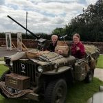 Two of our museum team in a military vehicle form the past.
