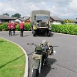 A military motorbike and lorry from the past.