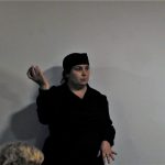 A living history reenactor inside The Devil's Porridge Museum.