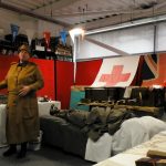 Some living history reenactors in The Devil's Porridge Museum's education room. One is on a bed.