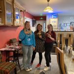 A youth worker and two of The Devil's Porridge Museum's team holding mocktails they made in The Devil's Porridge Museum's café.