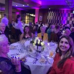 Some of our museum team looking very smart in formal evening dress. They are sat at a round table at the Thistle Awards.