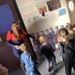 The children look around The Devil's Porridge Museum with the museum's Youth and Community Engagement Officer.