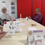 Some cards with calendars on the front displayed on a table.