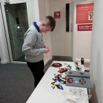 The young curator building a Lego planet.