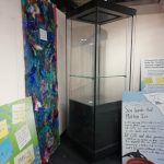 A display case and some of the exhibition panels waiting to be put up.