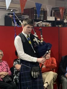 A bagpiper.