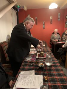 A man addressing the haggis.