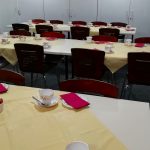Three tables arranged in rows and set for teas and coffees.