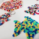 A fish, a seahorse, a mouse and a hexagon made out of Hama beads.