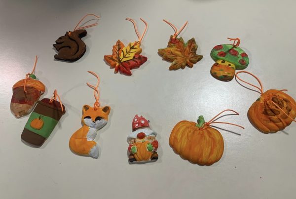A selection of hand painted autumnal decorations.