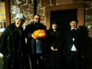 A group of people called, Mostly Ghostly stood outside the Old Bridge House.