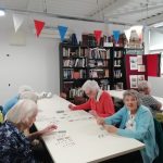 A game of cards being played by some members of Cordite Club.