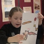 A young person looking at the artwork created at Mostly Ghostly's workshop in The Devil's Porridge Museum.