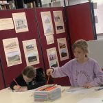 Young people drawing as part of Mostly Ghostly's storytelling workshop.