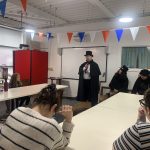 People listening to Mostly Ghostly in The Devil's Porridge Museum's education room.
