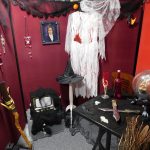 Halloween decorations arranged to create a witches room.