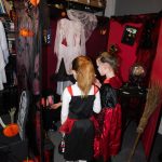 Children looking at the witches house decorations.