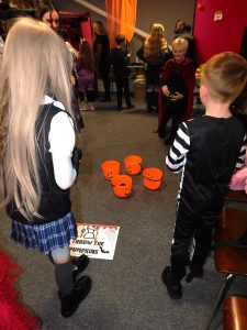 Children playing throw the pumpkin.