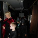Children in Halloween costumes in the trench section of The Devil's Porridge Museum.
