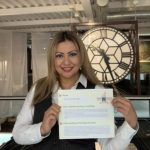 The Devil's Porridge Museum's Youth and Community Engagement Officer with a document she has written for heritage careers week 2024.