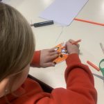 A young person colouring in.
