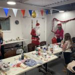 Santa visiting the Craft your Christmas workshop.