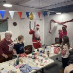 Santa visiting the Craft your Christmas workshop.