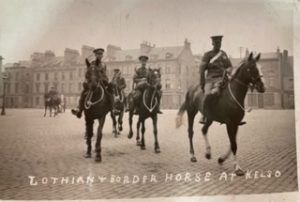 People riding houses in military uniforms. Some text reads Lothian Border Horse at Kelso.