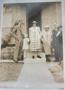 Some people, including Tom Bonsor's parents stood in front of a door. This is an archive photo.