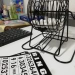 A Bingo game and cards set out on a table.