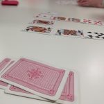 Some playing cards arranged on a table.