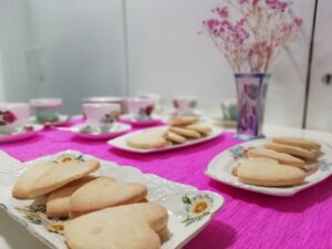 Some heart shortbread arranged on plates in The Devil's Porridge Museum's Education Room.