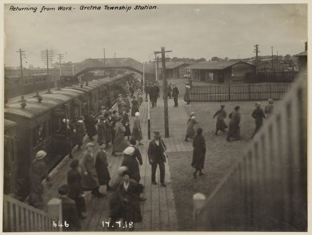 Munition girls going off duty Gretna township station. This photo is from the museum's archive. Some text at the top read "returning form work- Gretna Township station."