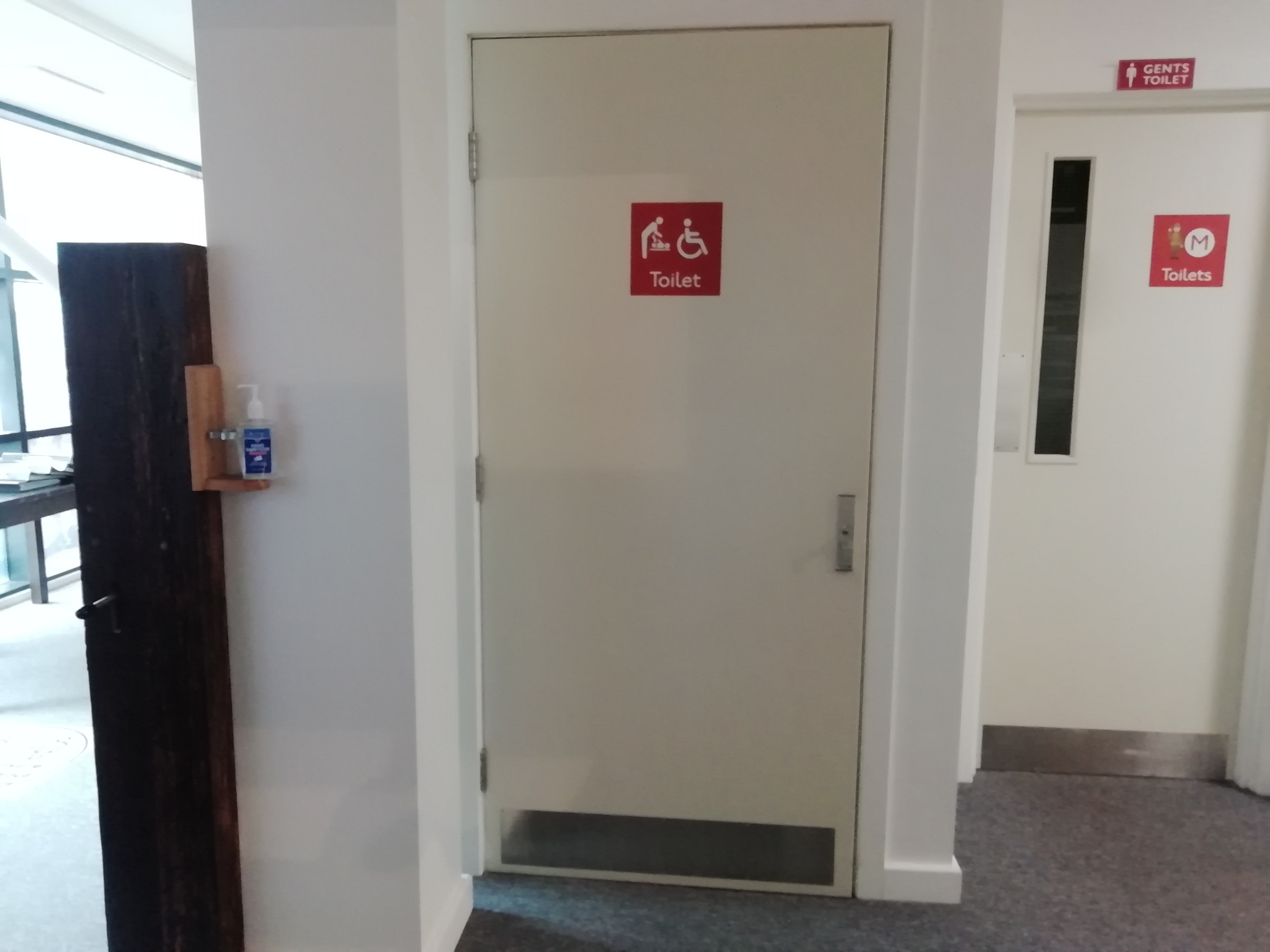Door to the accessible toilets downstairs in The Devil's Porridge Museum.