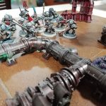 A selection of Warhammer miniatures arranged on a table.