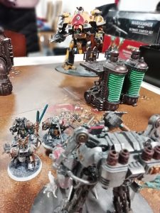 An arrangement of Warhammer miniatures on a table.