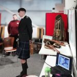 Young volunteer and bagpiper Scott stood in The Devil's Porridge Museum's education room talking.