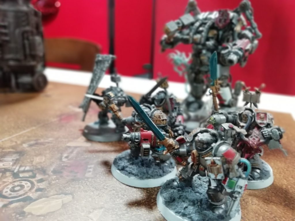 A selection of Warhammer miniatures arranged on a table.