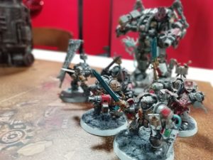 A selection of Warhammer miniatures arranged on a table.
